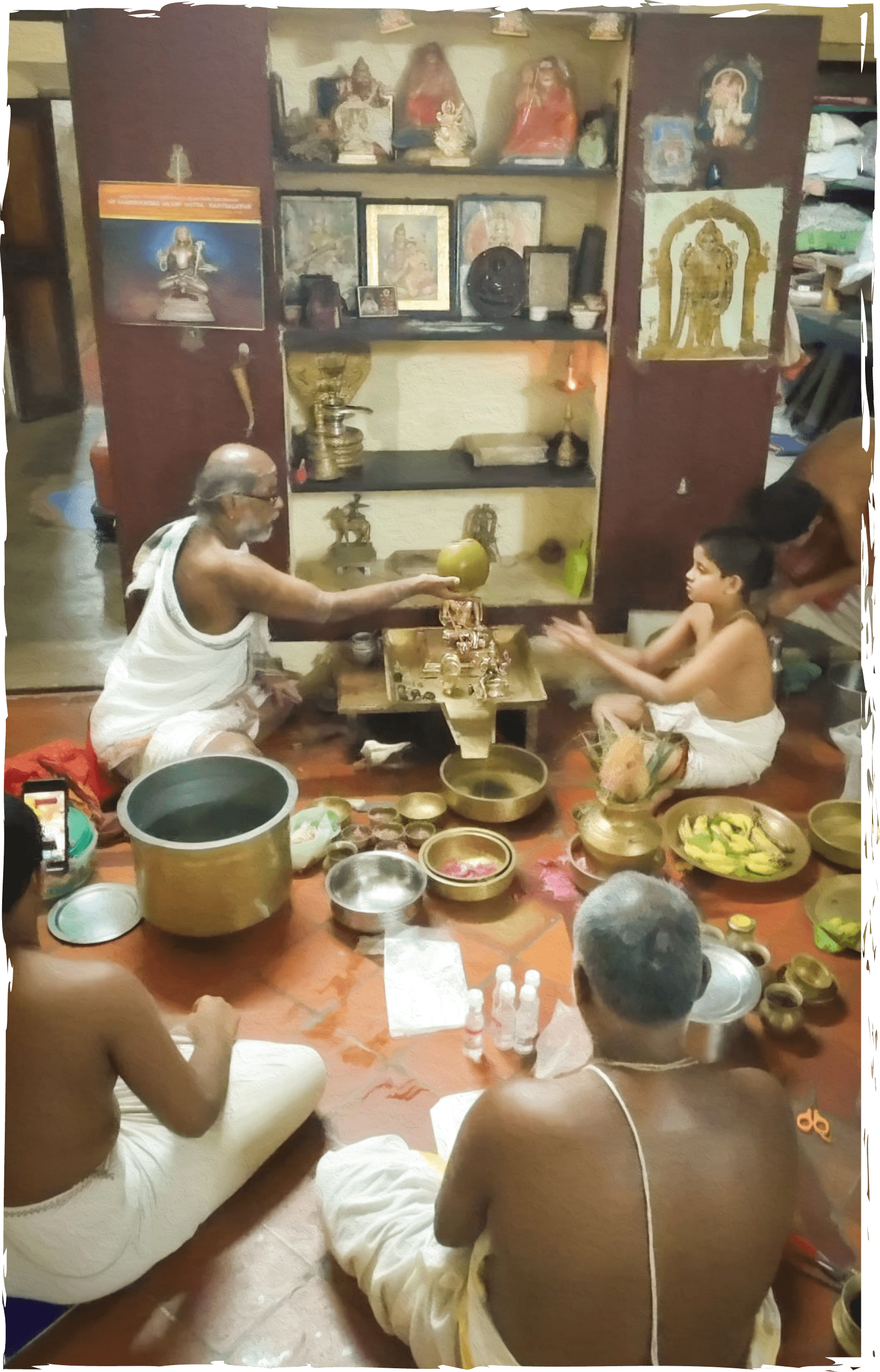 A group of Vedic priests and a student perform a ritual.